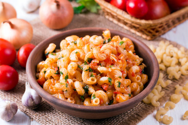 istock Pasta with tomato sauce on a plate on table 1033887060