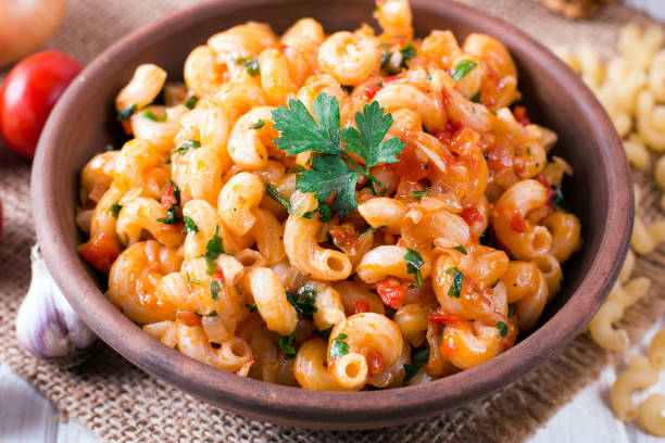 istock Pasta with tomato sauce on a plate on table 1033887070