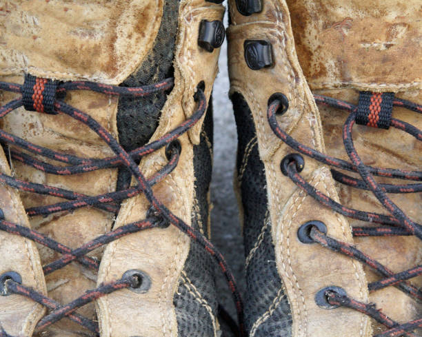 istock Grungy worn pair of hiking boots 1033887370