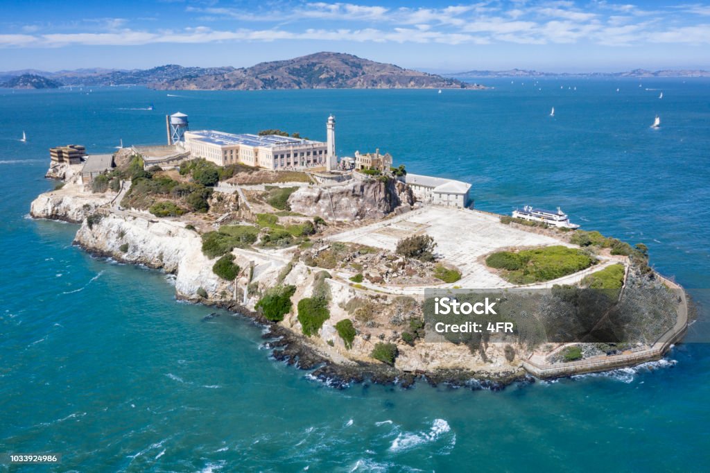 Alcatraz, San Francisco, California, USA Aerial of the famous Island Alcatraz by San Francisco in front of the Golden Gate Bridge. California, USA. Converted from RAW. Alcatraz Island Stock Photo