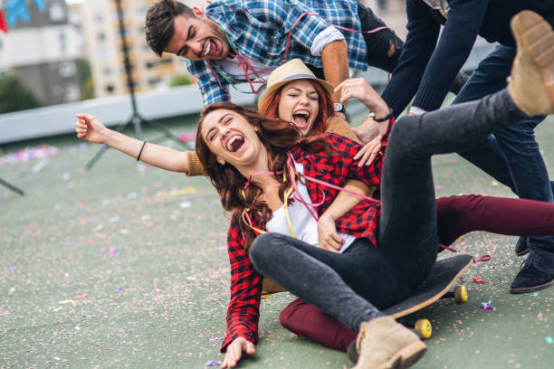 istock Happy people having fun with skateboard 1033935924