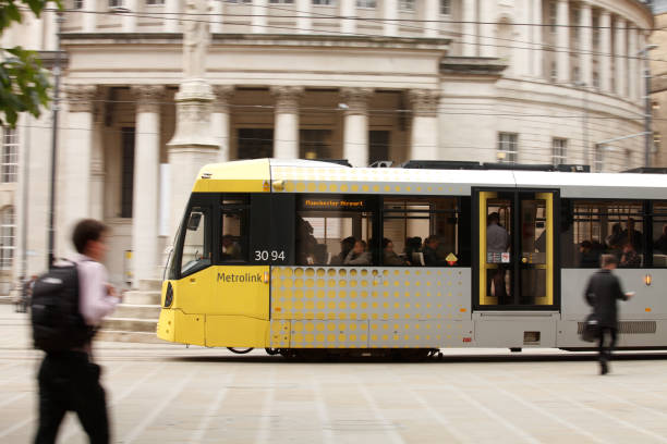 metrolink, the manchester's tram - blurred motion street car green imagens e fotografias de stock