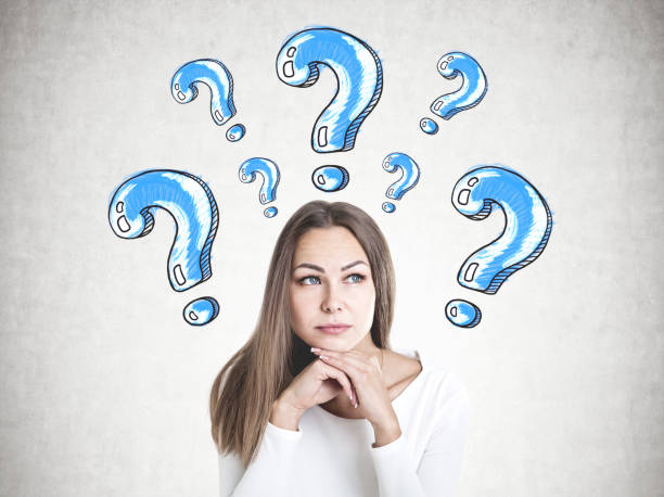 istock Clever young businesswoman thinking, question mark 1033950318
