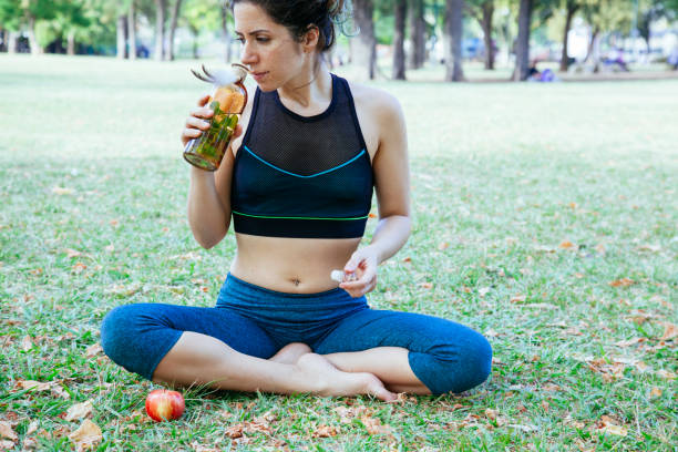 istock woman drinking a natural peppermint juice 1033950436