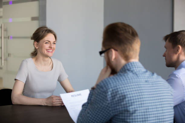 istock Confident female applicant smiling during job interview in office 1033950560