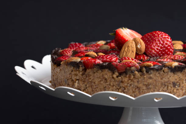 istock Close up raw vegan strawberry chocolate cake with almonds 1033954486