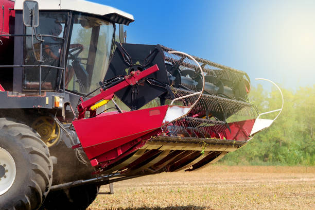 istock red combine harvester on a sunset background harvesting soybean 1033959644