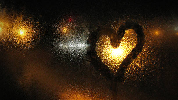 istock foggy window with drawn heart 1033959794