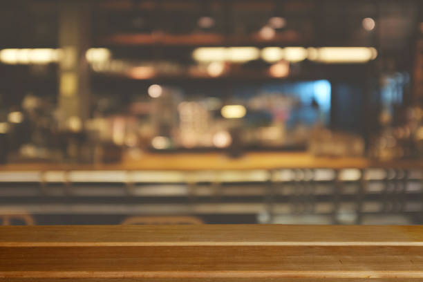 istock Wooden board empty table top on of blurred background. 1033960142