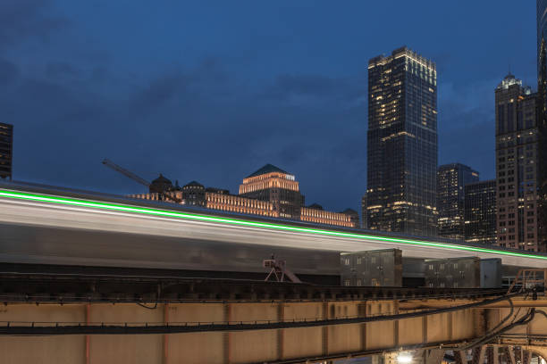 istock Green line of blurred train in urban scene 1033963154