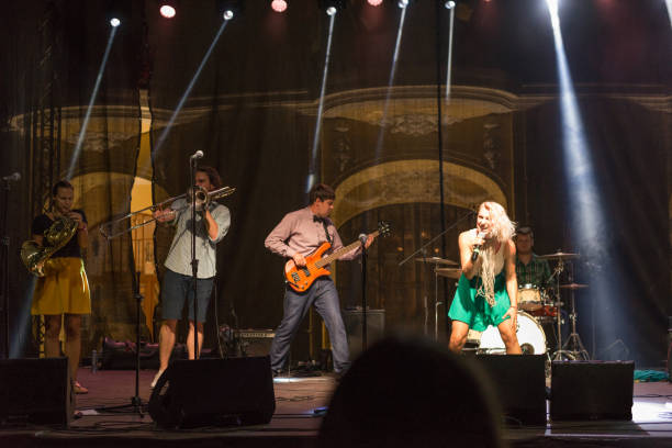 istock Rock band playing on the concert 1033963294