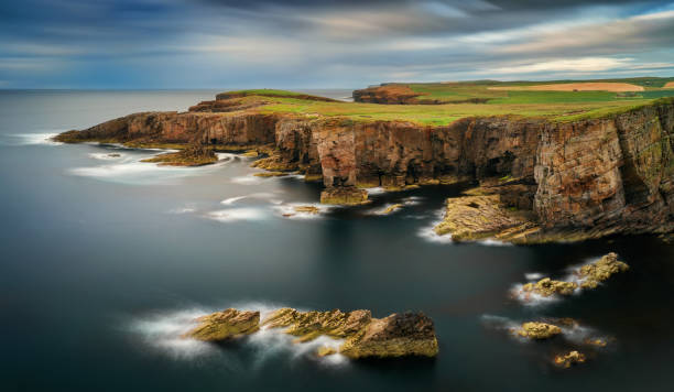 Yesnaby cliffs panorama Panorama of Yesnaby cliffs with Castle Rock in center, Orkney Islands, Scotland orkney islands stock pictures, royalty-free photos & images