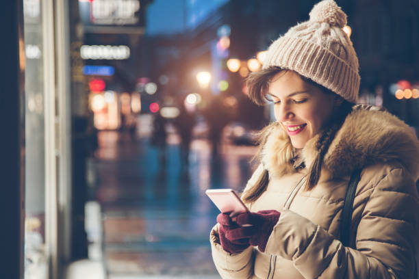 istock Woman using phone in the winter 1033970970