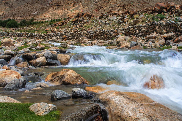 istock mountain stream on the way to the pass 1033974212