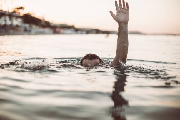 istock Hand of a sinking man in sea 1033982626