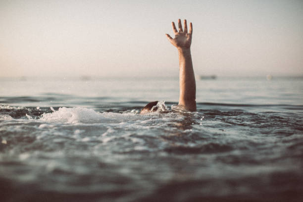 istock Drowning in the water 1033982994