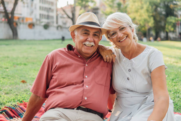 istock Senior couple hugging outdoors 1033983748