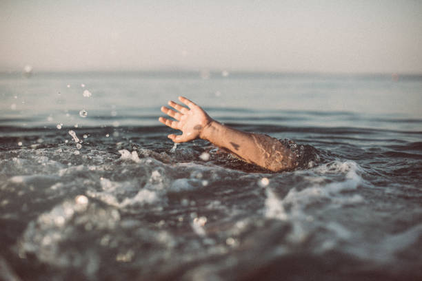 istock Man drowning in the sea 1033985180