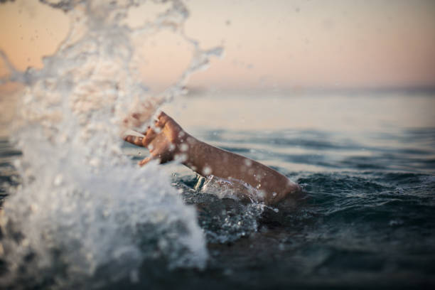 istock Hand of a sinking man 1033985252