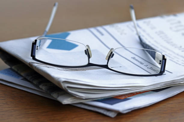 istock A pair of reading glasses for reading. Many people need a vision aid for reading 1033996530