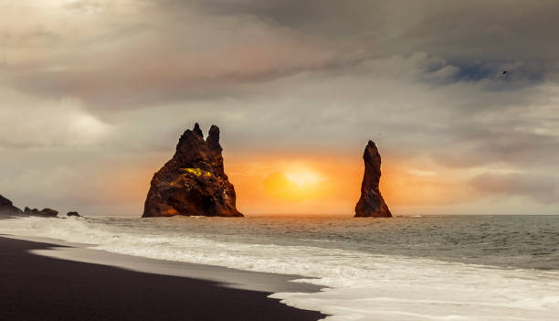 istock two famous rock pillars in front of the black beach 1034003636