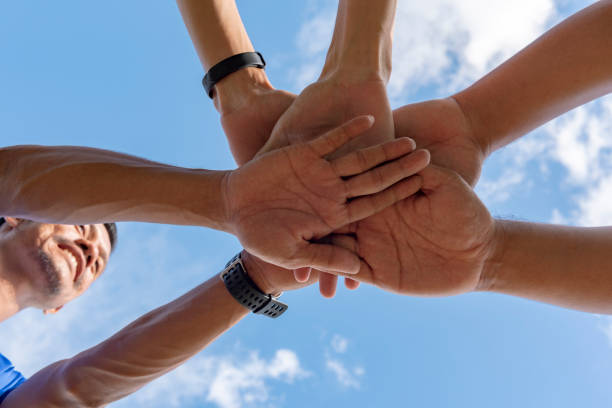 istock People use hand coordination to express their collective strength. 1034027246