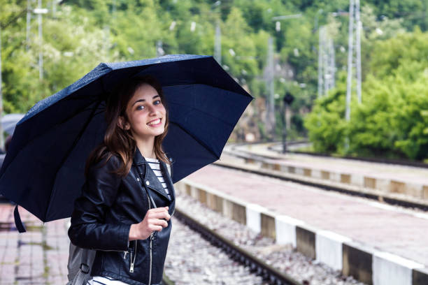 istock Girl waiting on the railway station 1034035110