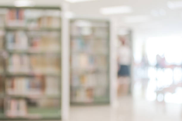 istock Blur school library or study room with book shelves for education background 1034035218