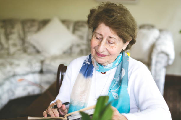 istock Mature woman reading and studying 1034038982