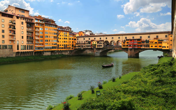 View of Ponte Vecchio the famous arch bridge across Arno river in Florence (Firenze), Tuscany, Italy stock photo