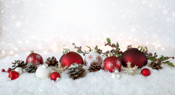 istock Christmas holiday elegant baubles with falling snow and glittery lights 1034039438