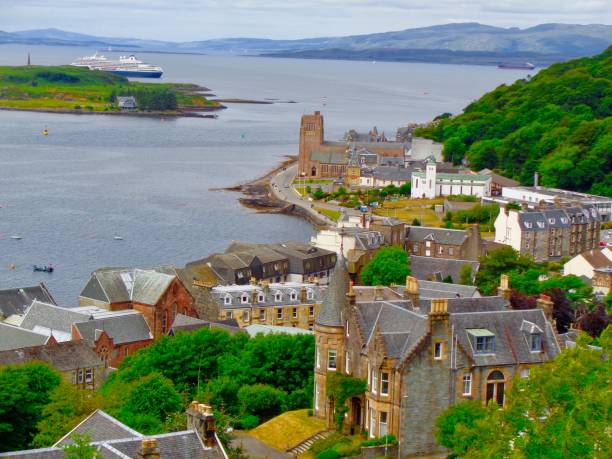Looking down onto Oban, Scotland This is a roof-top of Oban, Scotland during a typical Scottish summer day. oban stock pictures, royalty-free photos & images