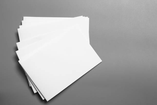 istock Blank portrait mock-up paper. brochure magazine isolated on gray, changeable background / white paper isolated on gray 1034063432