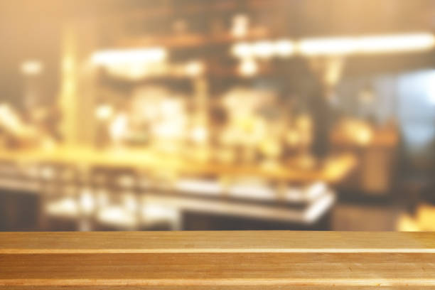 istock Wooden board empty table top on of blurred background. 1034066002