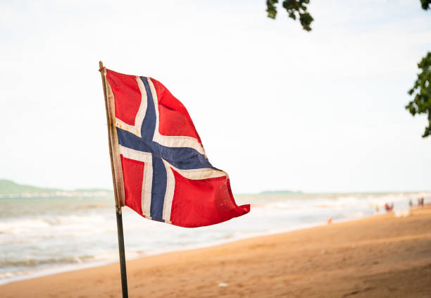 istock The Norwegian flag waving in the wind 1034069110