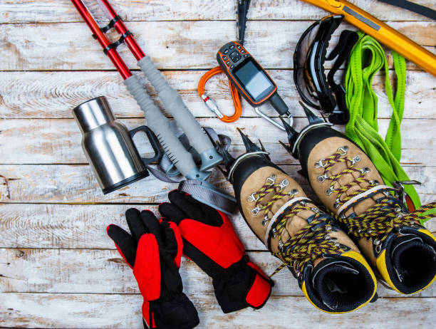 istock climbing equipment on a wooden background 1034078832