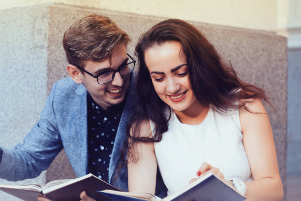 Happy couple reading books