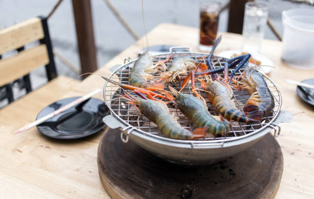 istock shrimp grill on chacoal barbecue on table 1034086264