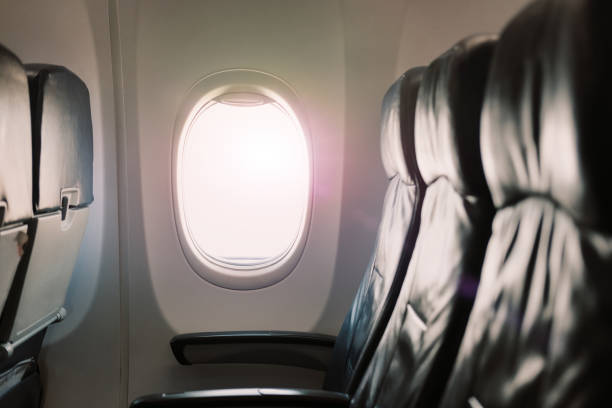 istock Airplane or jet window on wall with morning light 1034105384
