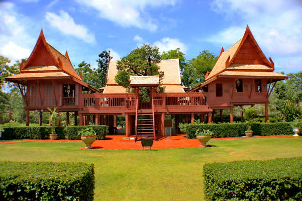 istock Thai style house with garden and sky backdrop. 1034107896