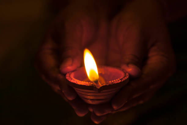 istock Clay lamp burning for Diwali festival 1034115572