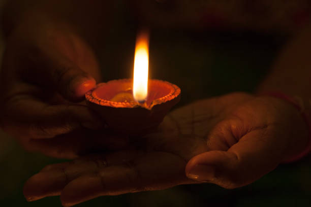 istock Clay lamp burning for Diwali festival 1034118528