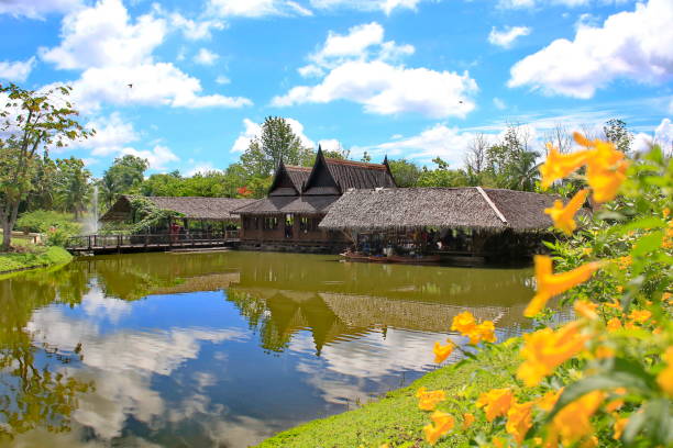 istock Thai style house with garden and sky backdrop. 1034122790