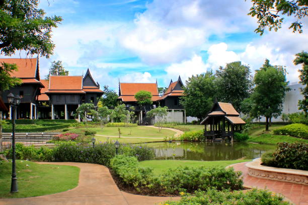 istock Thai style house with garden and sky backdrop. 1034122866