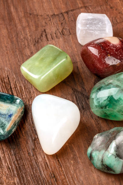 istock Semiprecious gemstones on a dark wooden background 1034126598