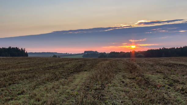 istock Sunrise with field and forest, Czech landscape 1034128894