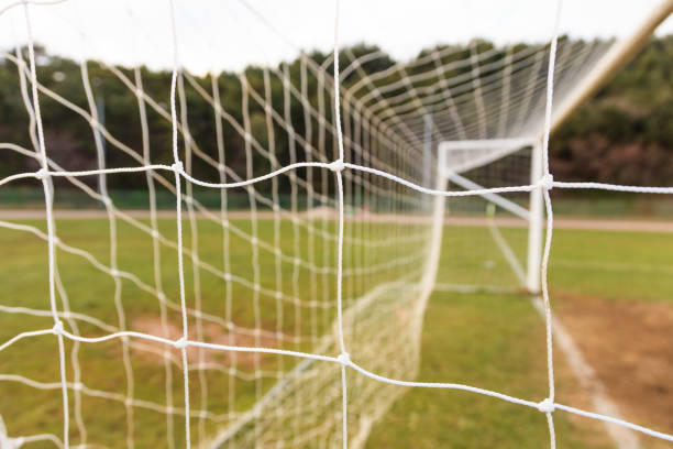 istock Football goal net close up 1034131262