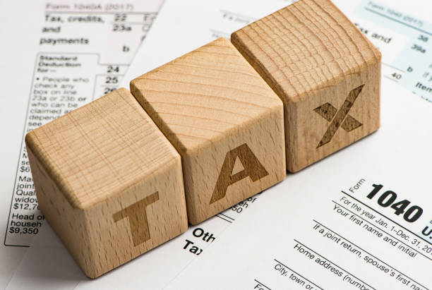 istock Tax characters and tax forms. 1034146380