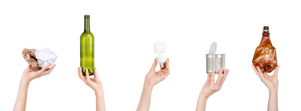istock Hands holding crumpled paper, bulb, glass and plastic bottles, tin can isolated on white background. Copyspace for text. Recycling, reuse, garbage disposal, resources environment and ecology concept. 1034152120