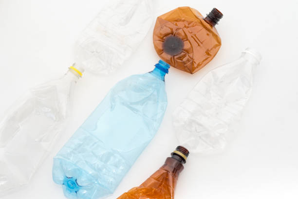 istock Different types of crushed plastic bottles on white background. Recyclable waste. Recycling, reuse, garbage disposal, resources, environment and ecology concept 1034152140